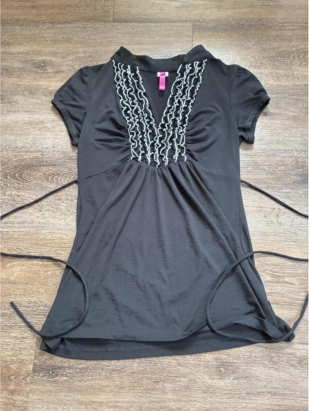 Black ruffle babydoll top with back tie! Tagged size large, adjustable